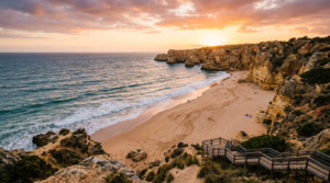 A breathtaking, cinematic wide shot of a pristine golden-sand beach framed by dramatic limestone cli